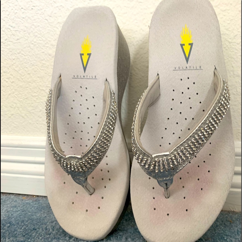Size 7 sparkling rhinestone volatile flip flops!